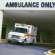 An ambulance parked outside of a hospital.